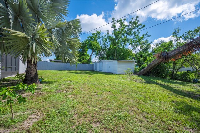 1231 Melville Ave, Lakeland, FL 33805 - fenced backyard with a storage unit