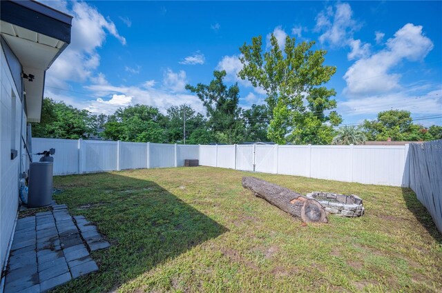 1231 Melville Ave, Lakeland, FL 33805 - fenced backyard with an outdoor fire pit