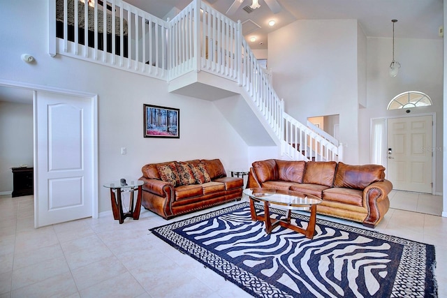 3782 Rollingsford Cir, Lakeland, FL 33810 - living room featuring high vaulted ceiling, tile patterned flooring, and stairs