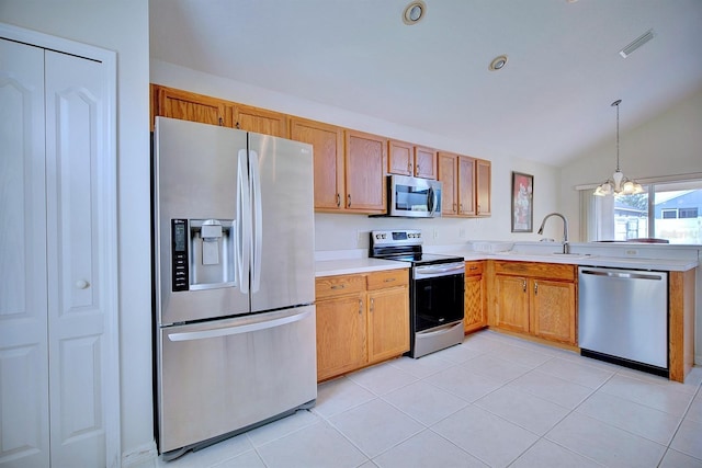3782 Rollingsford Cir, Lakeland, FL 33810 - kitchen with stainless steel appliances, lofted ceiling, light countertops, a chandelier, and a peninsula