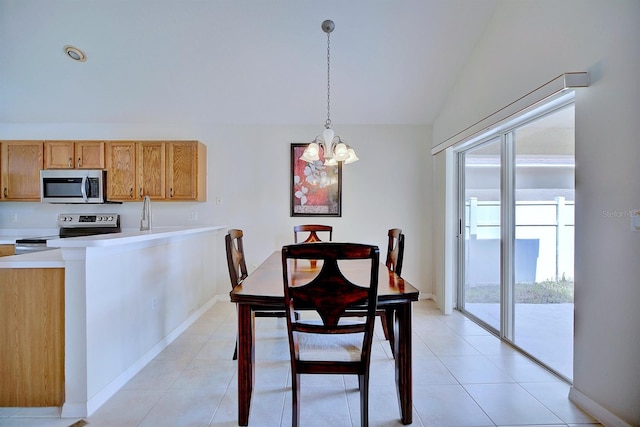 3782 Rollingsford Cir, Lakeland, FL 33810 - dining room with a chandelier, vaulted ceiling, plenty of natural light, and light tile patterned floors