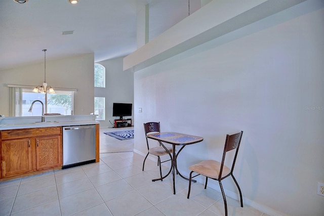 3782 Rollingsford Cir, Lakeland, FL 33810 - kitchen with dishwasher, lofted ceiling, a chandelier, brown cabinets, and light countertops