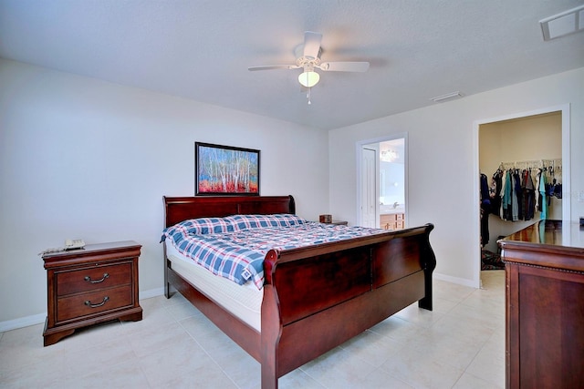 3782 Rollingsford Cir, Lakeland, FL 33810 - bedroom featuring a spacious closet, a closet, a ceiling fan, and ensuite bathroom