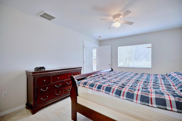 3782 Rollingsford Cir, Lakeland, FL 33810 - bedroom with ceiling fan and light tile patterned flooring