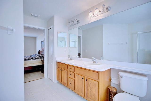 3782 Rollingsford Cir, Lakeland, FL 33810 - ensuite bathroom featuring double vanity and tile patterned flooring