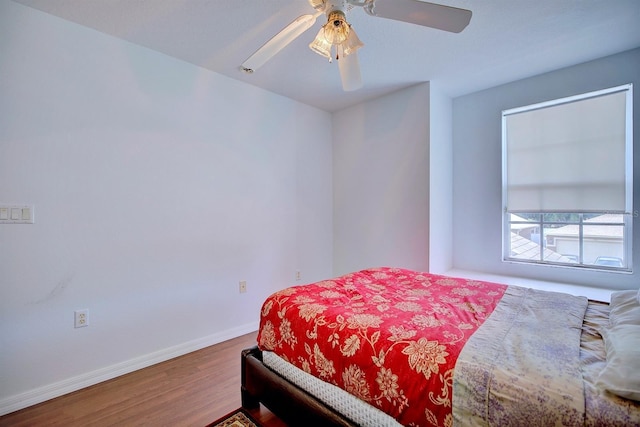 3782 Rollingsford Cir, Lakeland, FL 33810 - bedroom featuring wood finished floors and ceiling fan