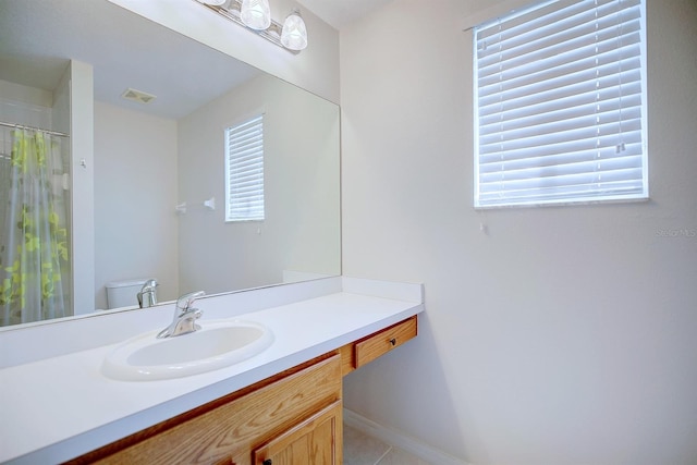 3782 Rollingsford Cir, Lakeland, FL 33810 - bathroom featuring plenty of natural light, vanity, tile patterned floors, and curtained shower