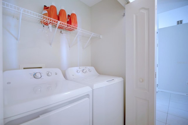3782 Rollingsford Cir, Lakeland, FL 33810 - laundry room featuring separate washer and dryer and light tile patterned floors