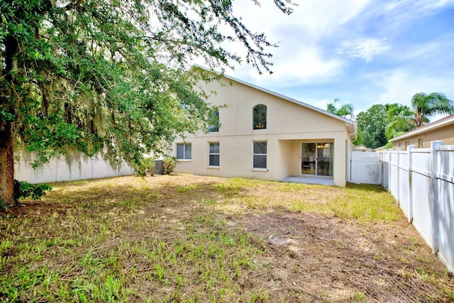3782 Rollingsford Cir, Lakeland, FL 33810 - rear view of property featuring stucco siding, a fenced backyard, and a patio