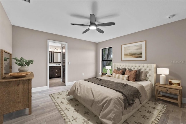 3063 Lantana Cir, Auburndale, FL 33823 - bedroom featuring light wood-style flooring, ensuite bath, and ceiling fan