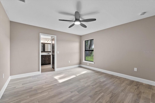 3063 Lantana Cir, Auburndale, FL 33823 - unfurnished room with light wood finished floors, ceiling fan, and a smoke detector