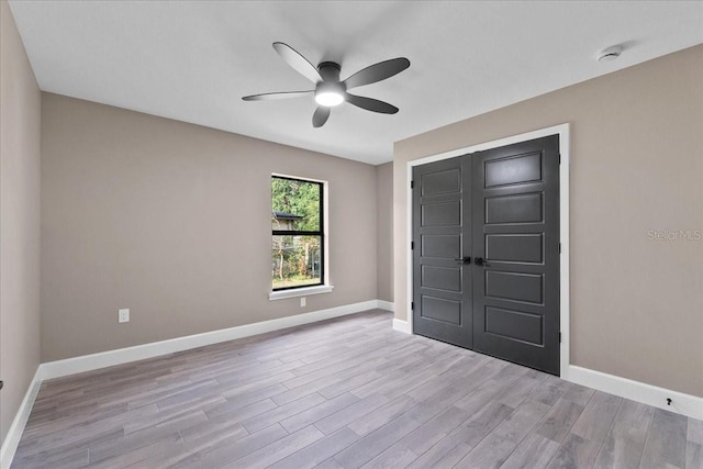3063 Lantana Cir, Auburndale, FL 33823 - unfurnished bedroom with light wood-style floors, ceiling fan, and a closet