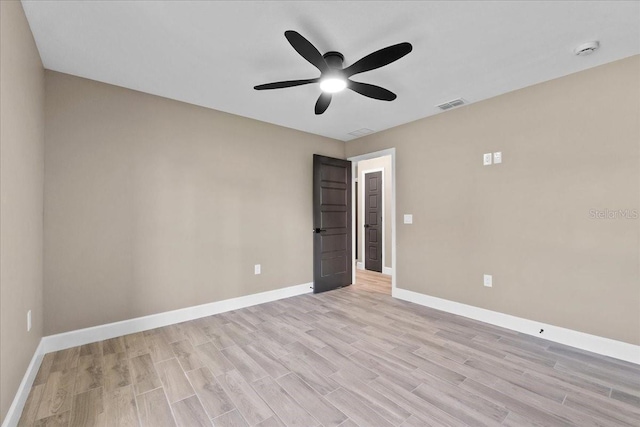 3063 Lantana Cir, Auburndale, FL 33823 - empty room with ceiling fan, a smoke detector, and light wood-style flooring