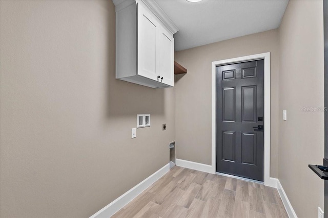 3063 Lantana Cir, Auburndale, FL 33823 - laundry area with electric dryer hookup, cabinet space, light wood-style floors, and hookup for a washing machine