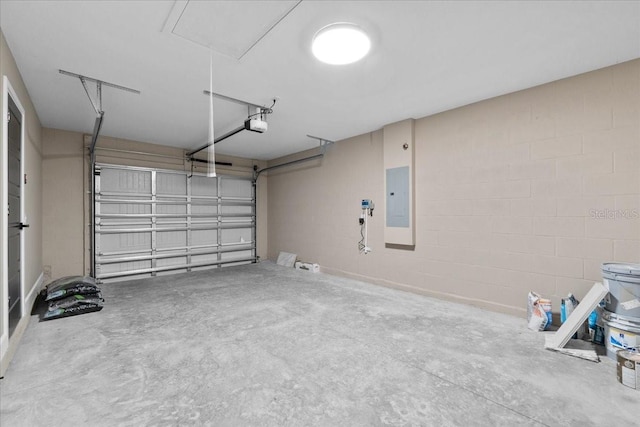 3063 Lantana Cir, Auburndale, FL 33823 - garage with electric panel, a garage door opener, and concrete block wall