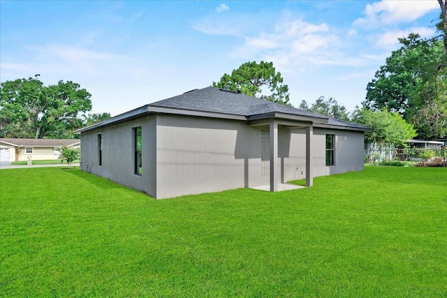3063 Lantana Cir, Auburndale, FL 33823 - back of property featuring stucco siding and roof with shingles