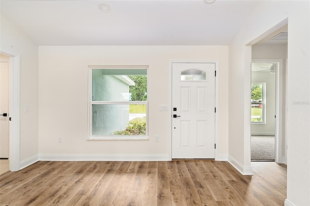 724 Voight Ave N, Fort Meade, FL 33841 - entrance foyer with healthy amount of natural light and wood finished floors