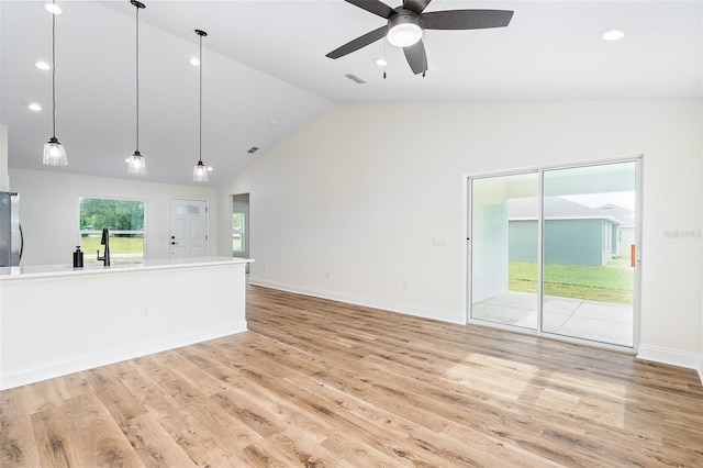 724 Voight Ave N, Fort Meade, FL 33841 - unfurnished living room featuring ceiling fan, light wood-style flooring, recessed lighting, and high vaulted ceiling