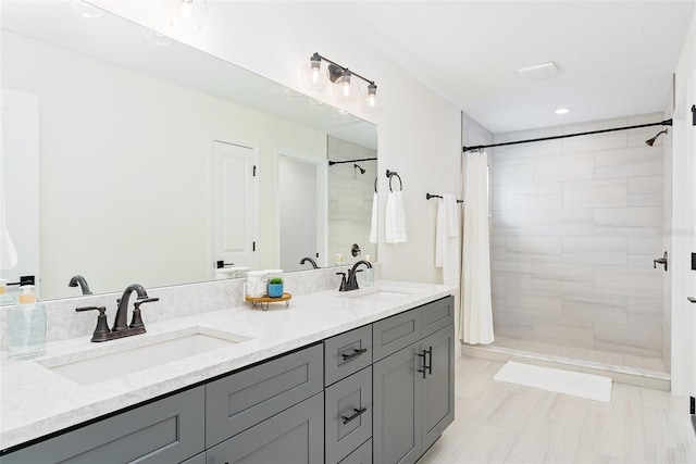724 Voight Ave N, Fort Meade, FL 33841 - full bathroom with double vanity, a tile shower, and recessed lighting