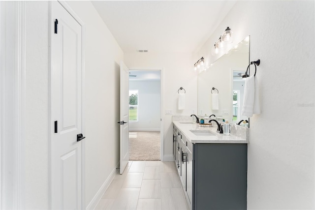 724 Voight Ave N, Fort Meade, FL 33841 - bathroom featuring double vanity and baseboards