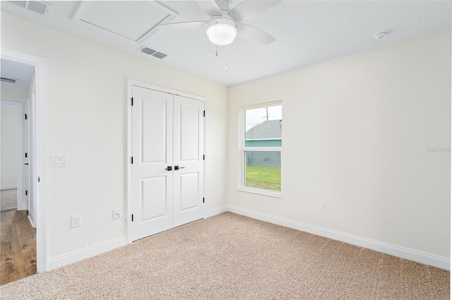724 Voight Ave N, Fort Meade, FL 33841 - unfurnished bedroom featuring light carpet, a closet, and ceiling fan