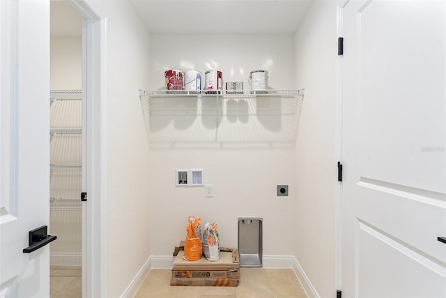 724 Voight Ave N, Fort Meade, FL 33841 - laundry room featuring electric dryer hookup, light tile patterned floors, and hookup for a washing machine
