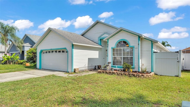 526 Allison Ave, Davenport, FL 33897 - view of front of house with an attached garage, driveway, and a gate