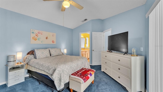 526 Allison Ave, Davenport, FL 33897 - bedroom with dark carpet, vaulted ceiling, ensuite bath, and ceiling fan