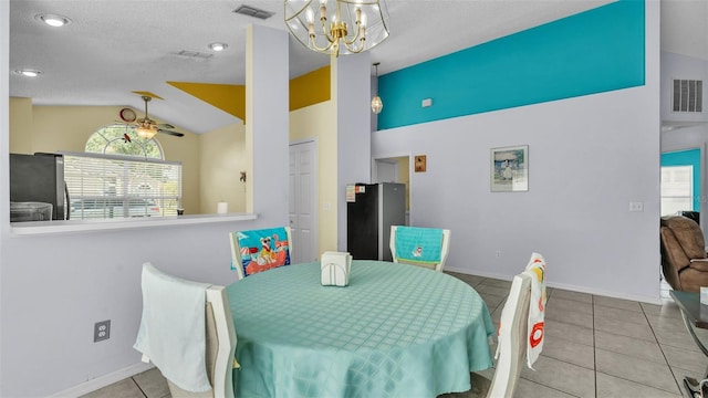 526 Allison Ave, Davenport, FL 33897 - tiled dining room featuring lofted ceiling, a chandelier, and a textured ceiling