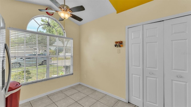 526 Allison Ave, Davenport, FL 33897 - unfurnished dining area with ceiling fan, light tile patterned floors, and lofted ceiling