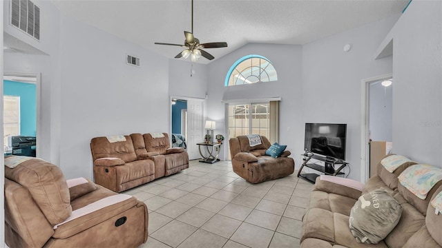 526 Allison Ave, Davenport, FL 33897 - living room featuring ceiling fan, light tile patterned floors, and high vaulted ceiling