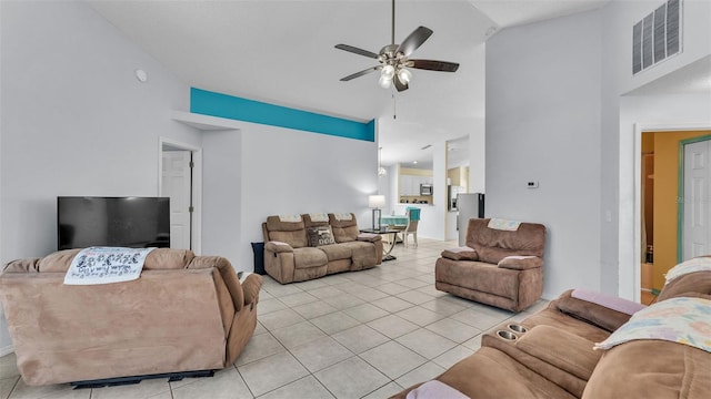 526 Allison Ave, Davenport, FL 33897 - living room with a ceiling fan, light tile patterned floors, and high vaulted ceiling