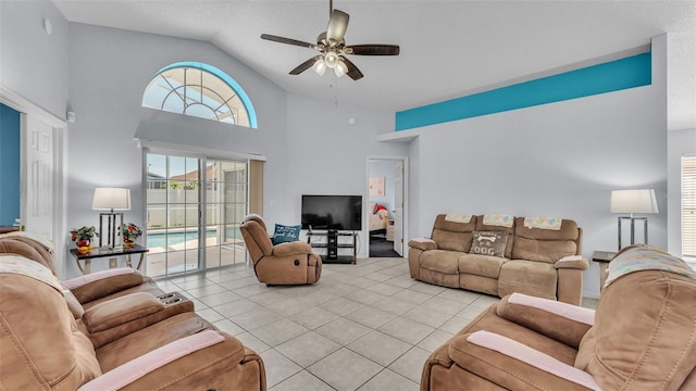 526 Allison Ave, Davenport, FL 33897 - living area featuring a ceiling fan, light tile patterned floors, and high vaulted ceiling
