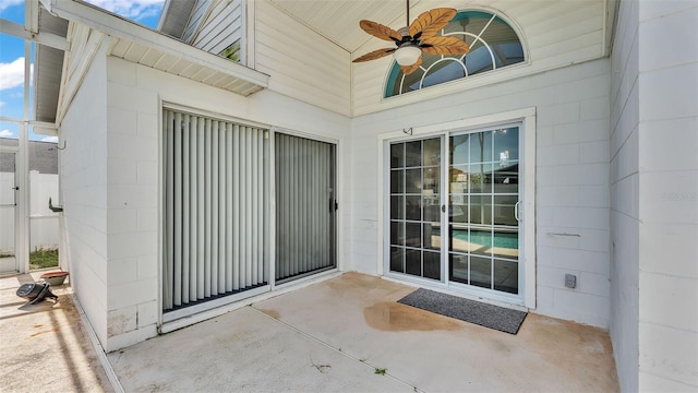 526 Allison Ave, Davenport, FL 33897 - doorway to property with concrete block siding, ceiling fan, and a patio area
