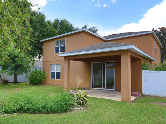 1911 Wind Meadows Dr, Bartow, FL 33830 - rear view of house featuring stucco siding, a patio, and roof with shingles