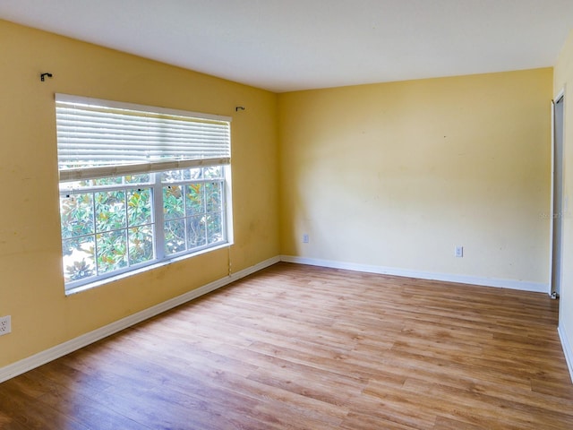 1911 Wind Meadows Dr, Bartow, FL 33830 - unfurnished room with wood finished floors and baseboards