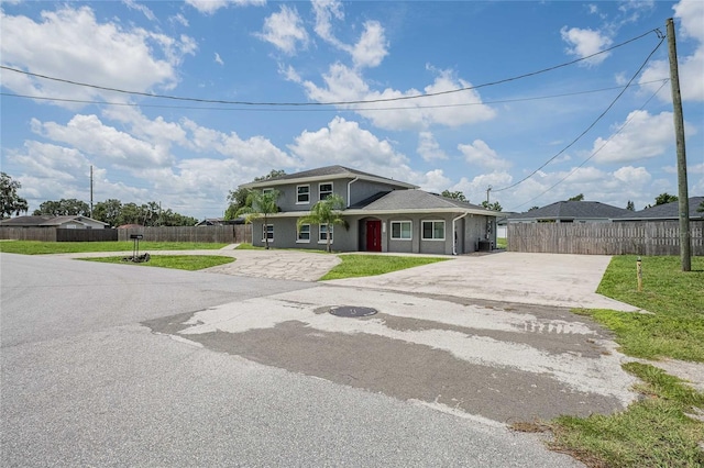 252 W Brookins Ave, Eagle Lake, FL 33839 - view of front of house featuring driveway and stucco siding