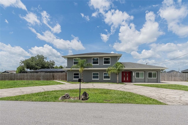 252 W Brookins Ave, Eagle Lake, FL 33839 - view of front of house featuring stucco siding and curved driveway