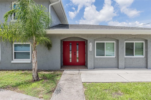 252 W Brookins Ave, Eagle Lake, FL 33839 - doorway to property featuring stucco siding