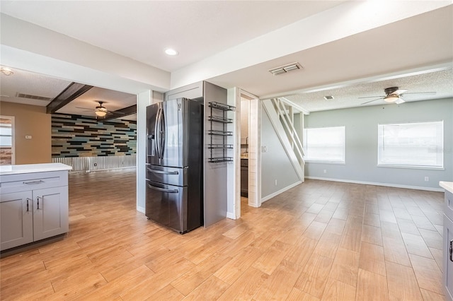 252 W Brookins Ave, Eagle Lake, FL 33839 - kitchen featuring ceiling fan, stainless steel fridge with ice dispenser, gray cabinets, and open floor plan