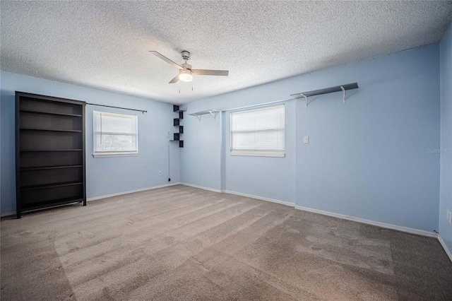 252 W Brookins Ave, Eagle Lake, FL 33839 - carpeted spare room with ceiling fan and a textured ceiling