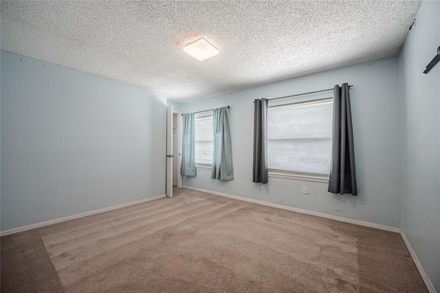 252 W Brookins Ave, Eagle Lake, FL 33839 - carpeted empty room with a textured ceiling and baseboards