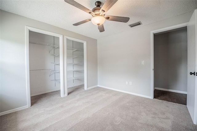 252 W Brookins Ave, Eagle Lake, FL 33839 - unfurnished bedroom with carpet flooring, a textured ceiling, and ceiling fan