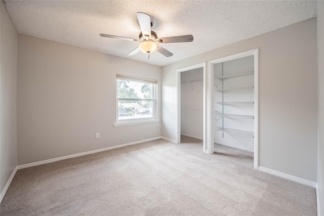 252 W Brookins Ave, Eagle Lake, FL 33839 - unfurnished bedroom featuring light carpet, a textured ceiling, and ceiling fan