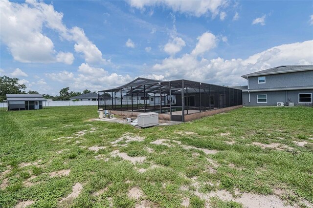 252 W Brookins Ave, Eagle Lake, FL 33839 - view of yard featuring a swimming pool and glass enclosure