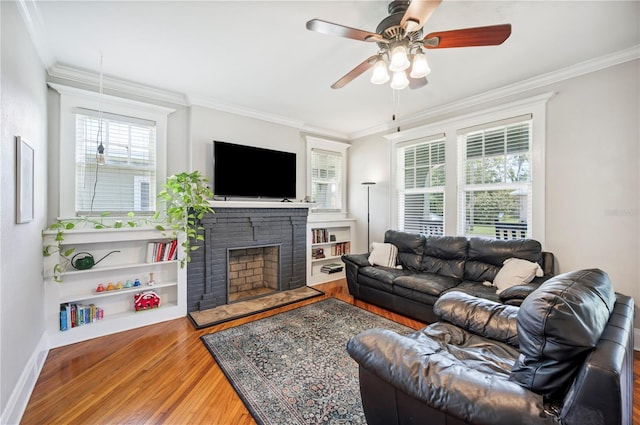 1515 King Ave, Lakeland, FL 33803 - living area featuring wood finished floors, ceiling fan, ornamental molding, and a fireplace