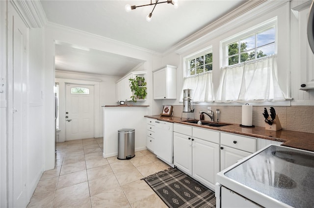 1515 King Ave, Lakeland, FL 33803 - kitchen with white appliances, dark countertops, white cabinets, tasteful backsplash, and ornamental molding