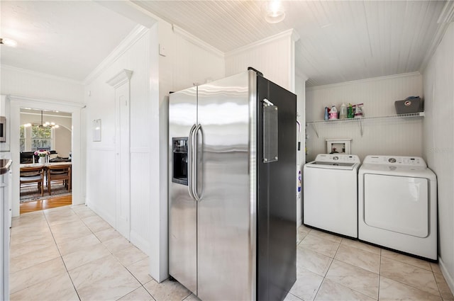 1515 King Ave, Lakeland, FL 33803 - washroom featuring washer and clothes dryer, crown molding, a chandelier, and wooden walls