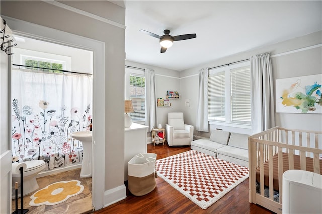 1515 King Ave, Lakeland, FL 33803 - bedroom with wood finished floors, a nursery area, and ceiling fan