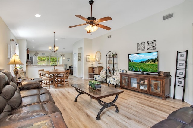 11607 Hammocks Glade Dr, Riverview, FL 33569 - living area featuring light wood finished floors, ceiling fan, a chandelier, recessed lighting, and lofted ceiling
